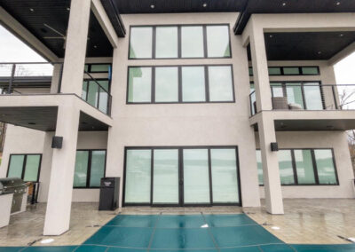 Modern luxury lakefront home with freshly cleaned windows