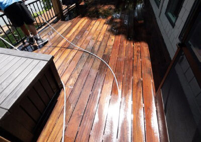 Residential wood deck freshly washed at lake home